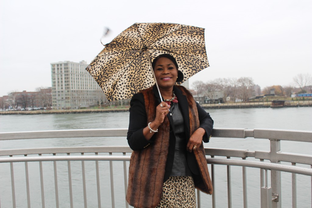 At East River, NYC. Wearing Forever 21 Faux Fur Vest, J.Crew Black School Boy Jacket, Piperlime Tindley Road Faux Leather Peplum Top, J. Crew Animal Print Skirt, Anne Klein Black Riding Boots and Totes Animal Print Umbrella.