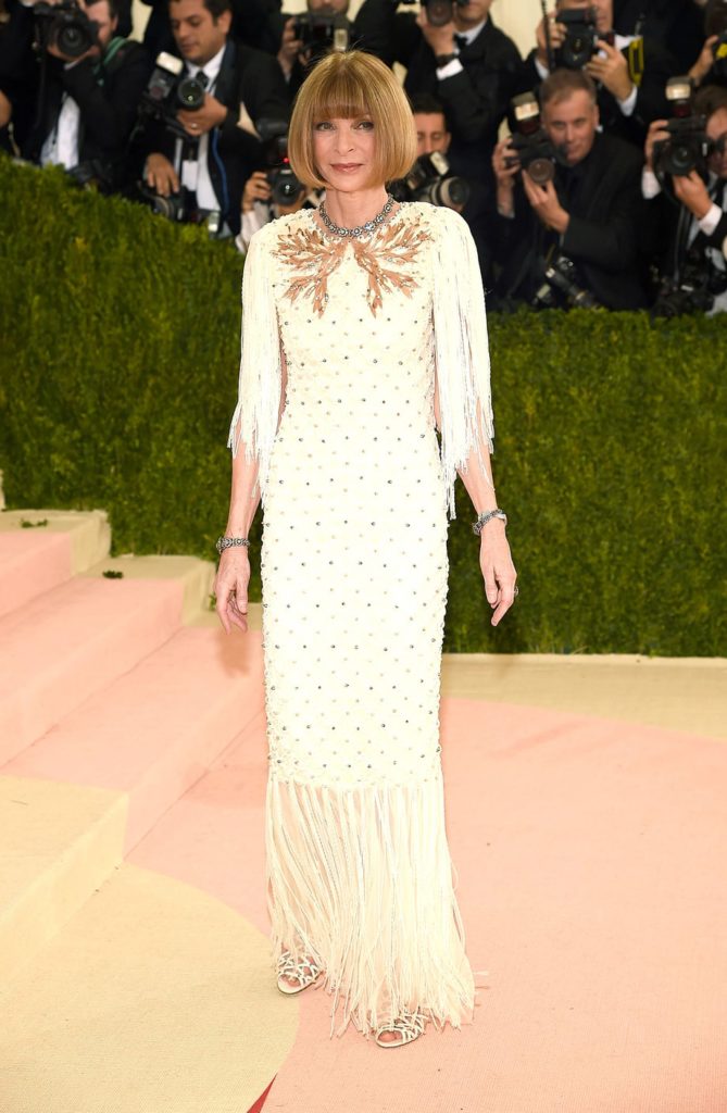 Anna Wintour in an ornate Chanel Haute Couture dress with fringe at the 2016 Met Gala.