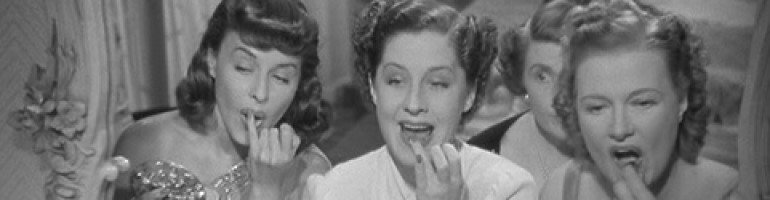Paulette Goddard, Norma Shearer, and Mary Boland perfecting their pouts in the ladies room in the movie, "The Women."