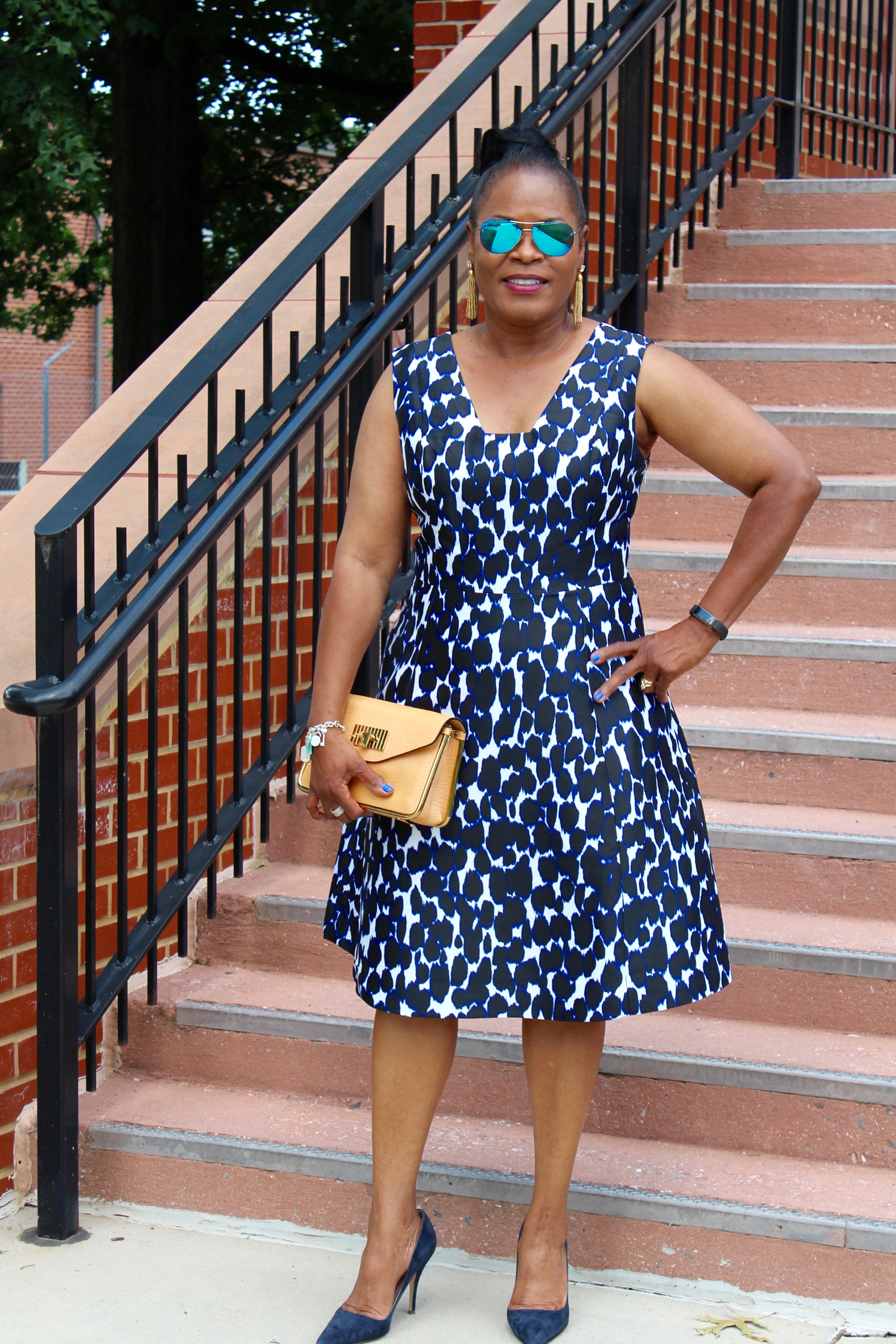 Wearing: Kate Spade Fit and Flare Navy Leopard-print Dress, Vintage Chloé Grained Sally Flap Calfskin Peach Clutch with Gold Chain, Kate Spade "Licorice" Navy Suede Heels , Ray-Ban Mirrored Aviators with J. Crew Gold Bead Tassel Earrings. 