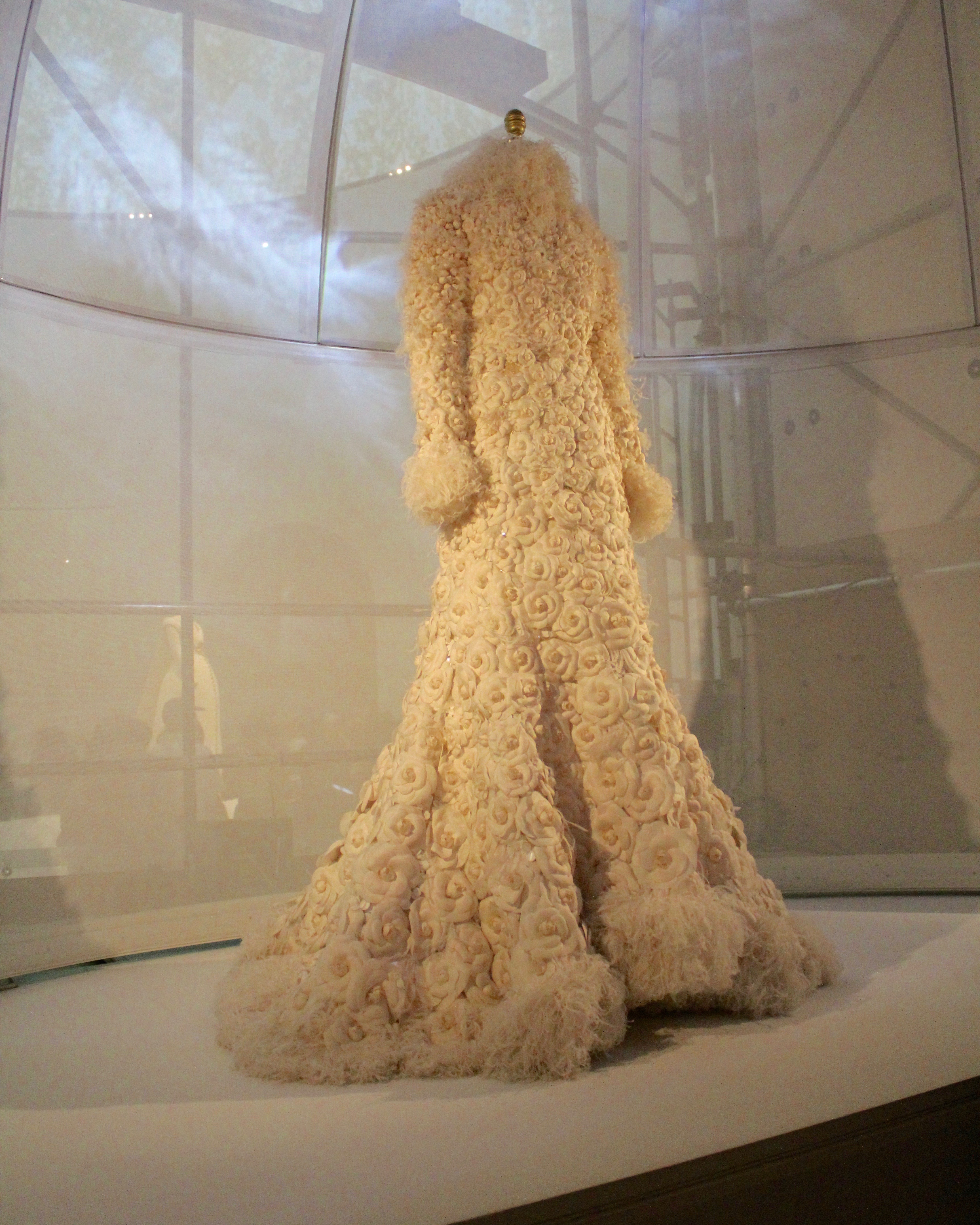 New York Calling: House of Chanel, Karl Lagerfeld, Wedding Ensemble, autumn/winter 2005-6, Haute Couture Hand-sewn white silk tulle and organza, hand-embroidered with 2,500 white silk camellias by Lemarié, white gelatin sequins and hand-glued and stitched white ostrich feathers.