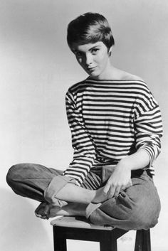 American actress, Jean Seberg wearing tuned-up (cuffed) jeans.