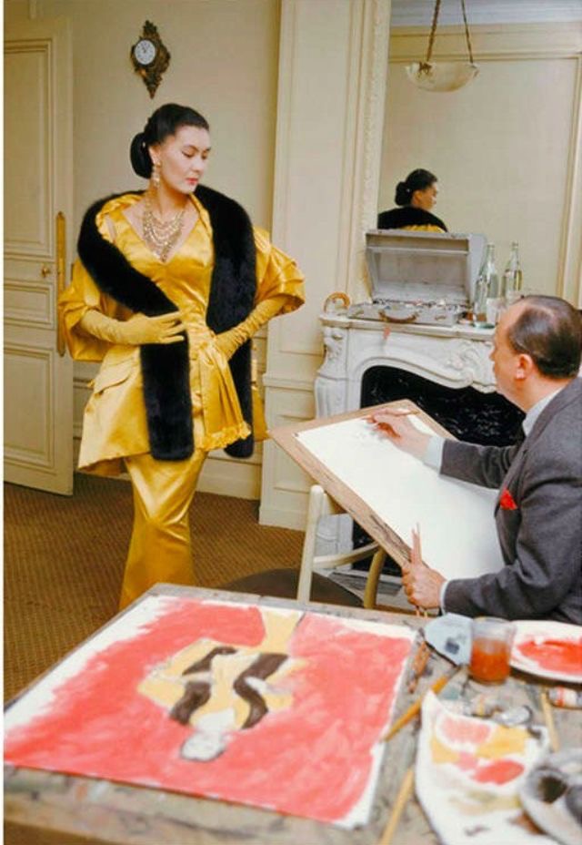 Yes, Mr. Dior. Fashion designer John Galliano inop display of ensembles.