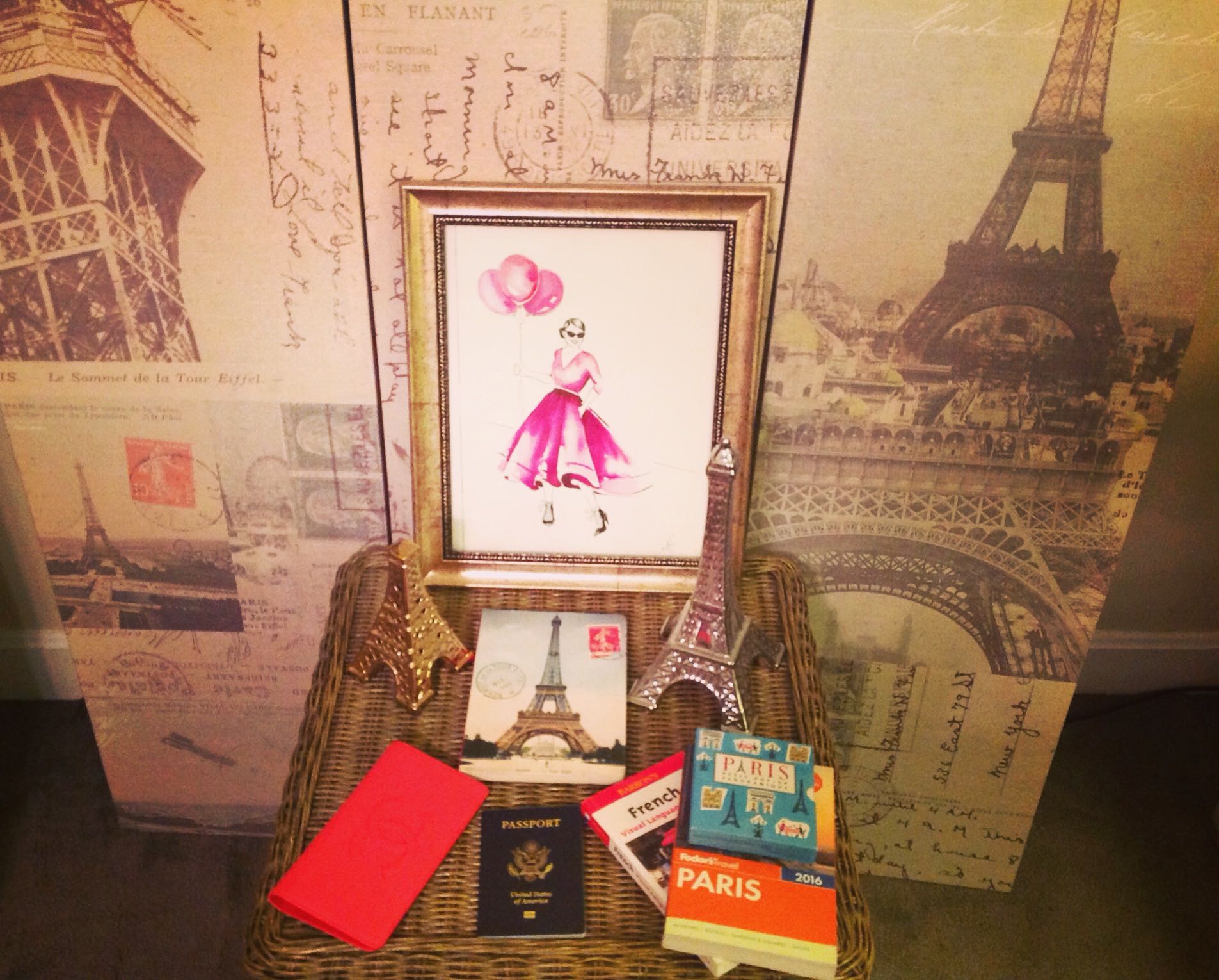 Paris Chic Essentials List. Passport, chic Chanel Yen Wallet from Fashionphile, Paris Travel Books.