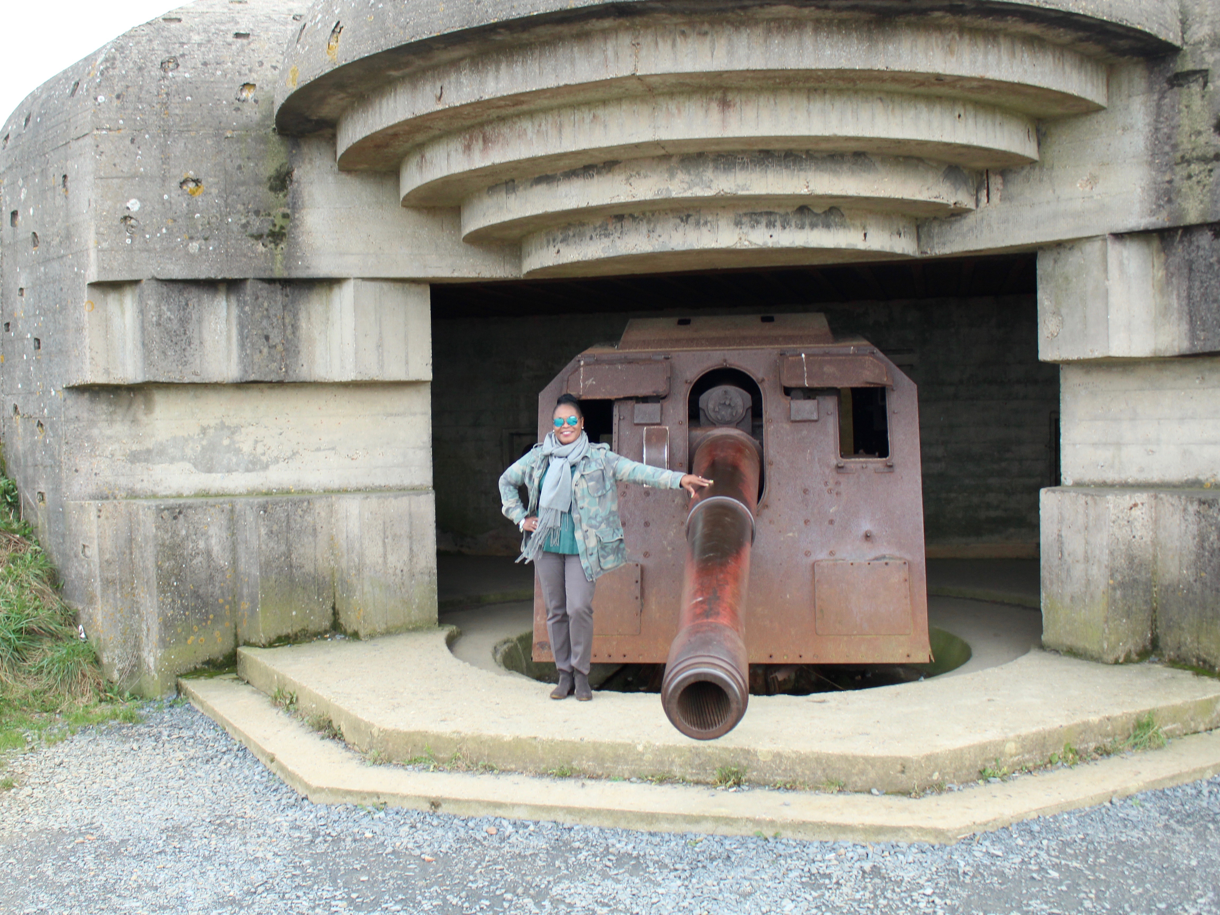 My Paris Trip, "'S Marvelous." Location: Longues sur Mer Gun Battery (German Bunker)located about 6-miles east of Omaha Beach. Wearing: Free People Not Your Brother's Jacket, J. Crew Minnie Pant, DSW J. Brand Bootie with grey wool scarf and Prada Mirror Blue Aviators.