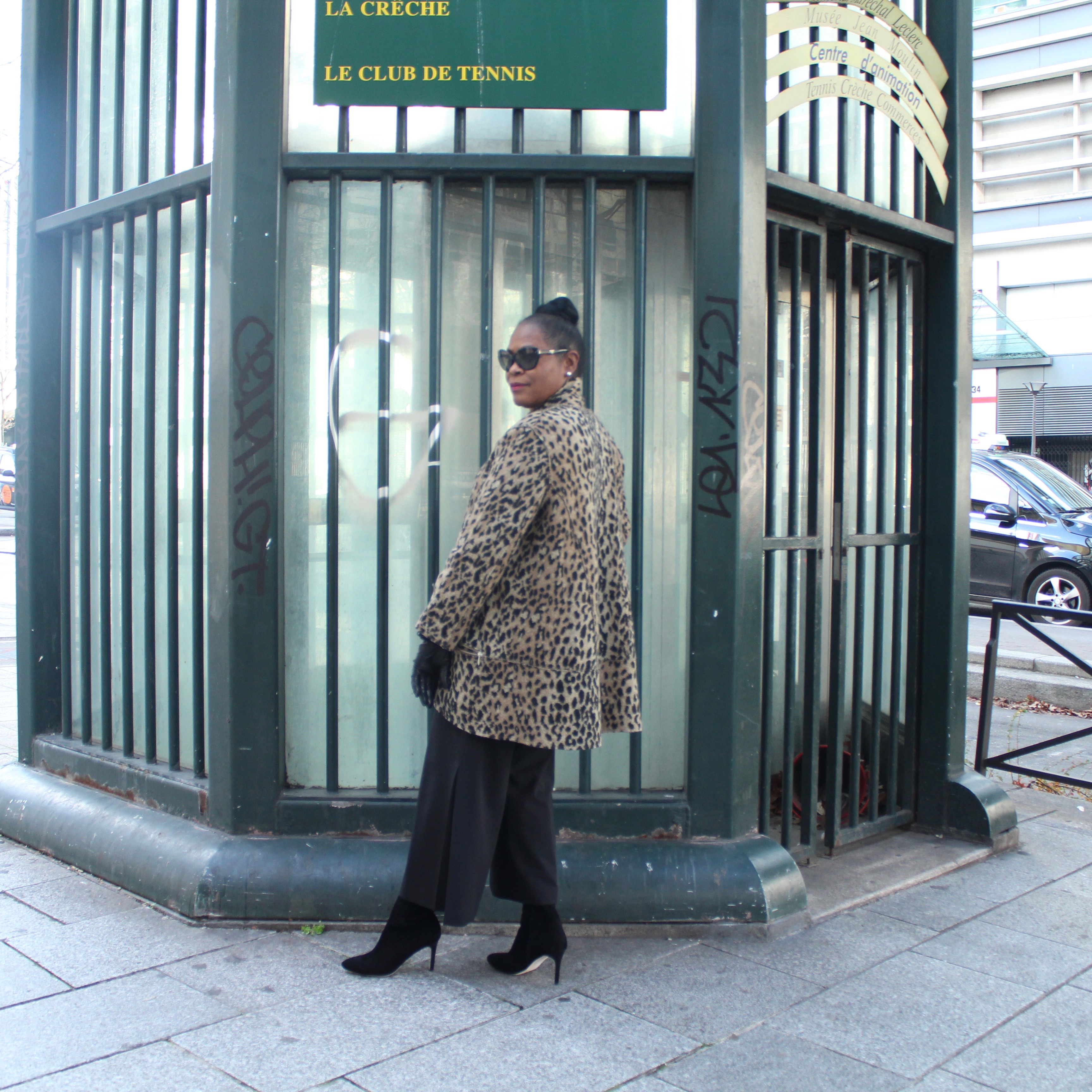 My Paris Trip, "'S Marvelous." Location: Galene Commerciale Gaite Montparnasse, Paris, France. Wearing: Metrostyle Leopard Sweater with wide-leg crop black pleated pants, Cole Haan Black Suede Over-The Knee Boots.
