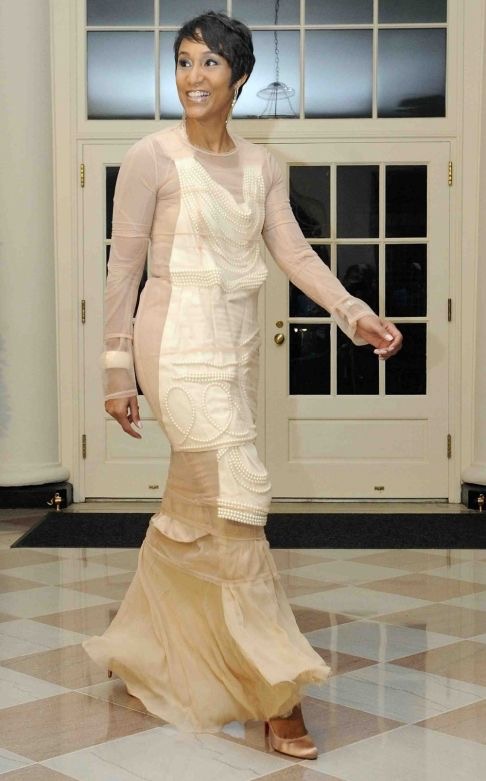 The November 29, 2009 Photo of former White House Social Secretary Desirée Rogers wearing effortless chic Comme des Garçons pale pink gown