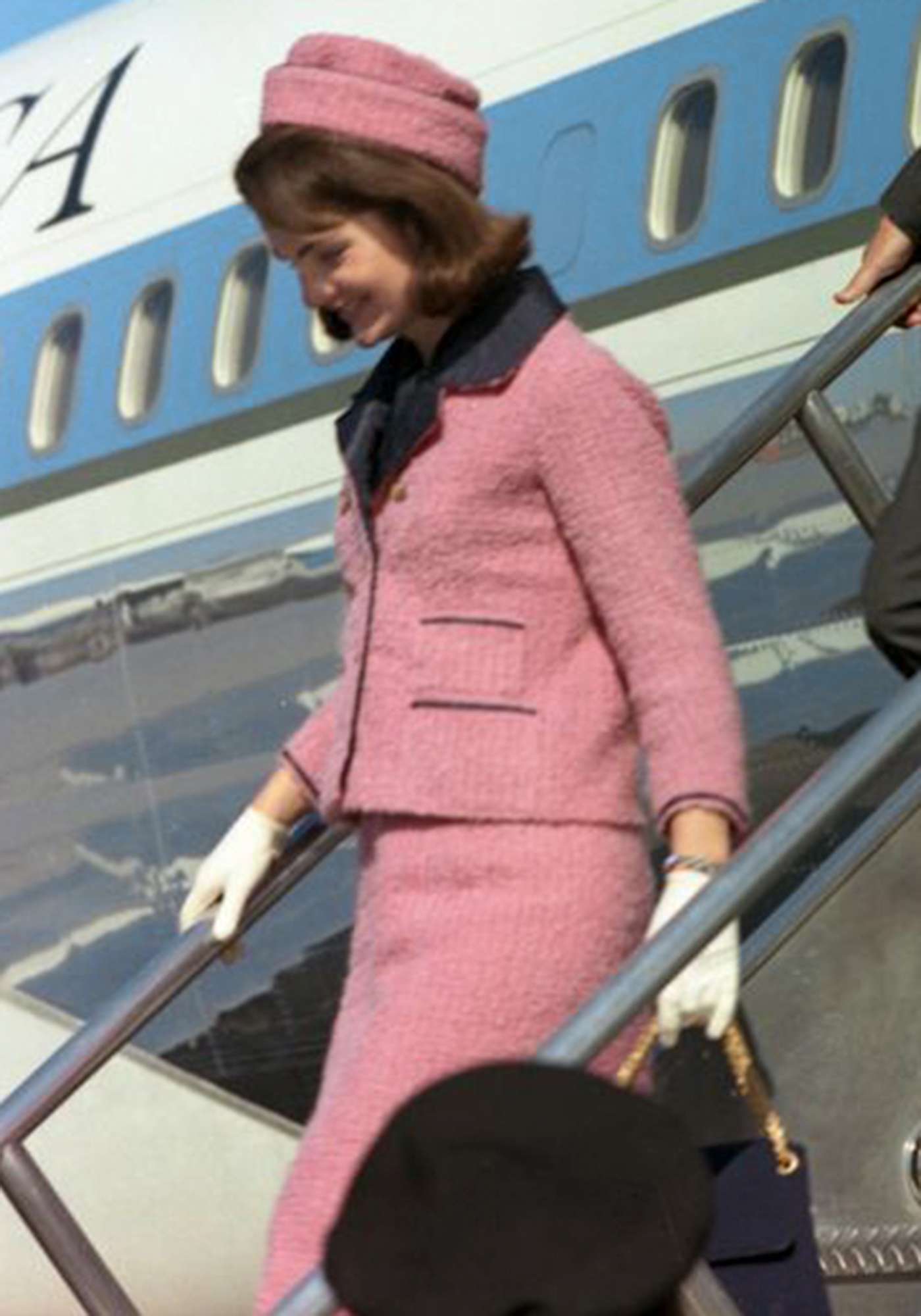 Jackie Kennedy getting off airplane in her pink suit in 1968