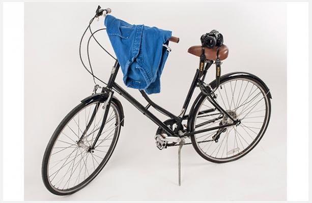 Online photo of Bill Cunningham's Mode of Transportation, HIs Blue Smock and the Nikon Camera