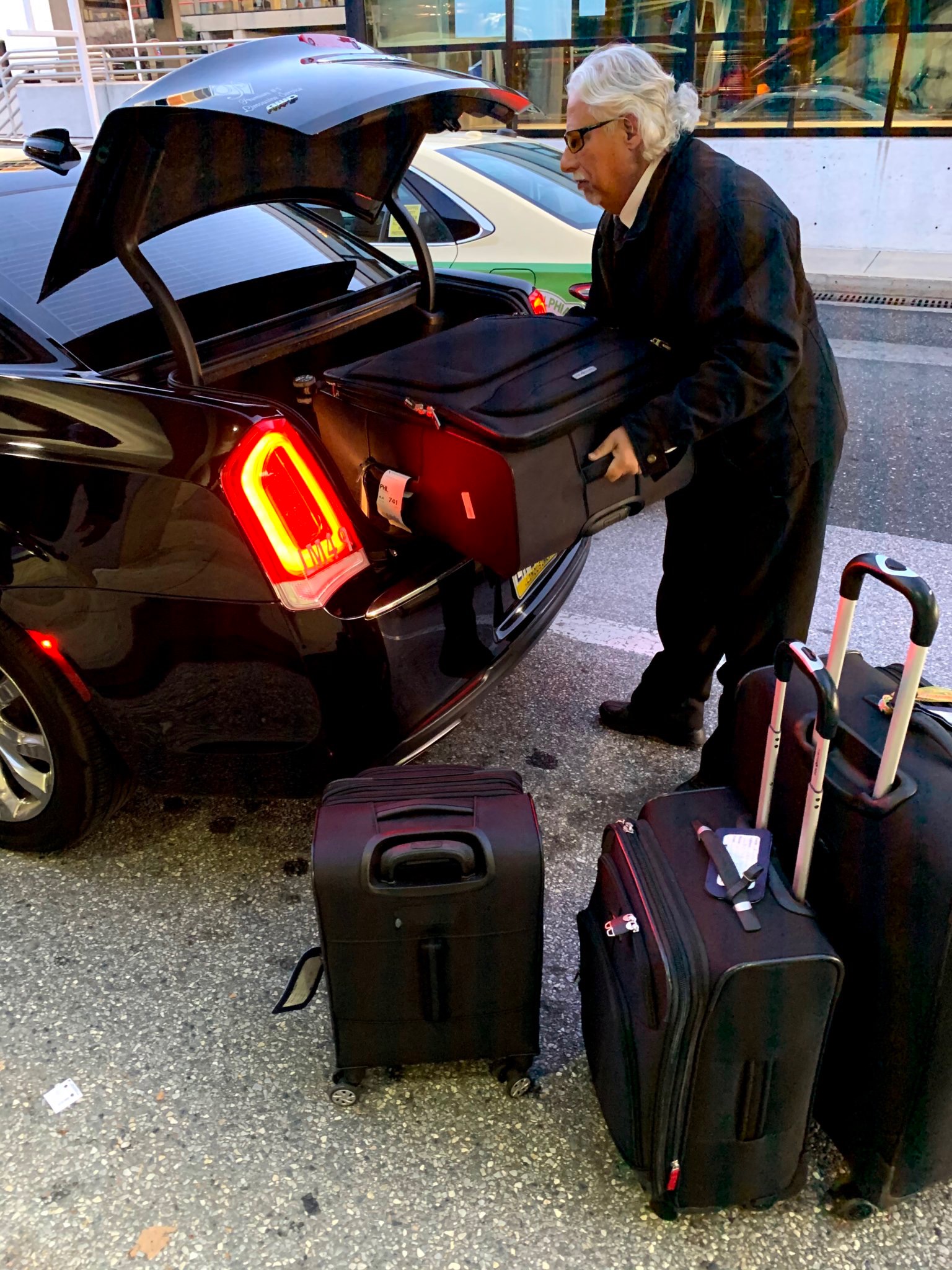 Premier Limousine Car Service loading our luggage at the Philly Airport