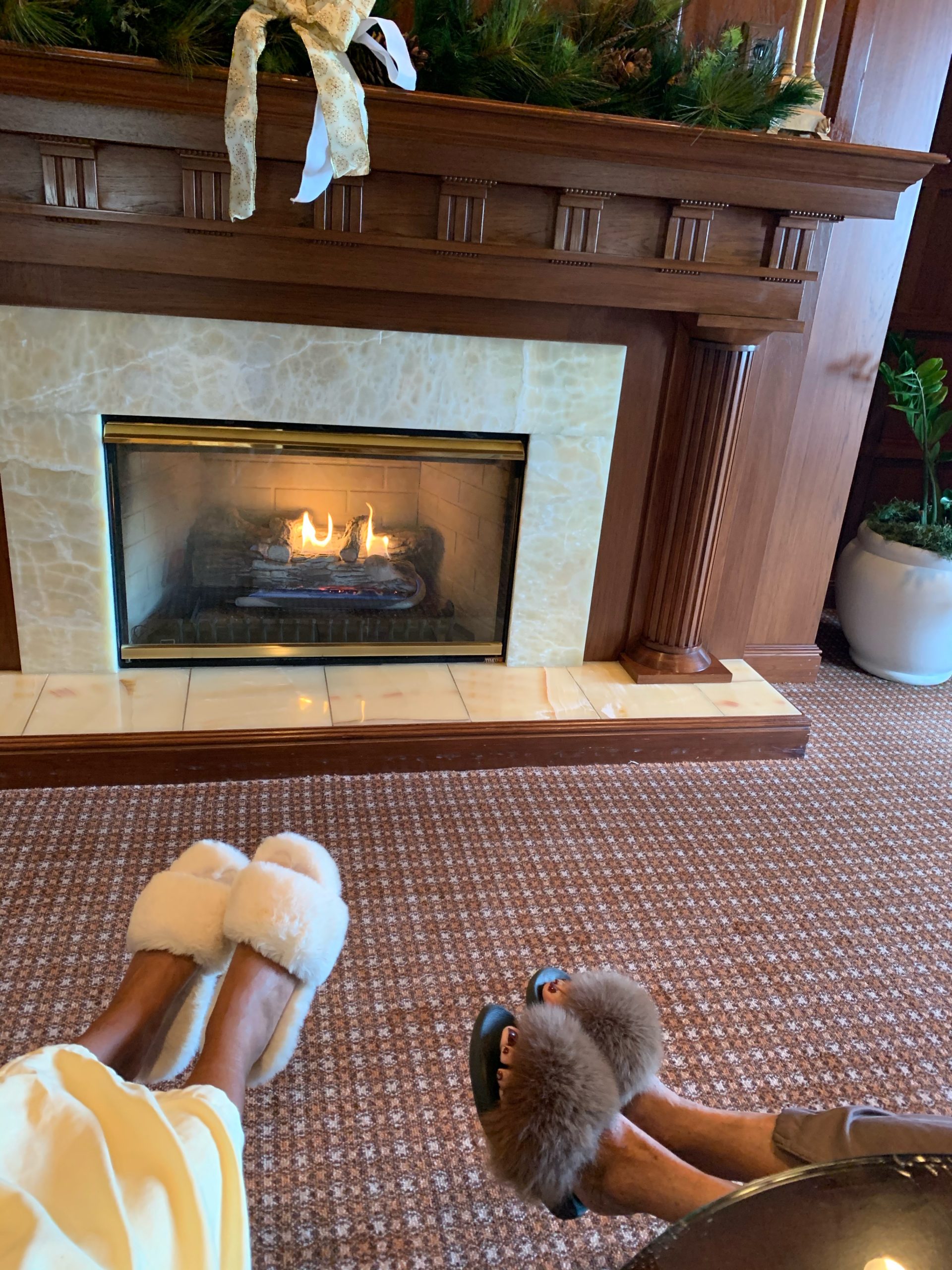 Our furry slippers by the fireplace, the Spa at The Hotel Hershey