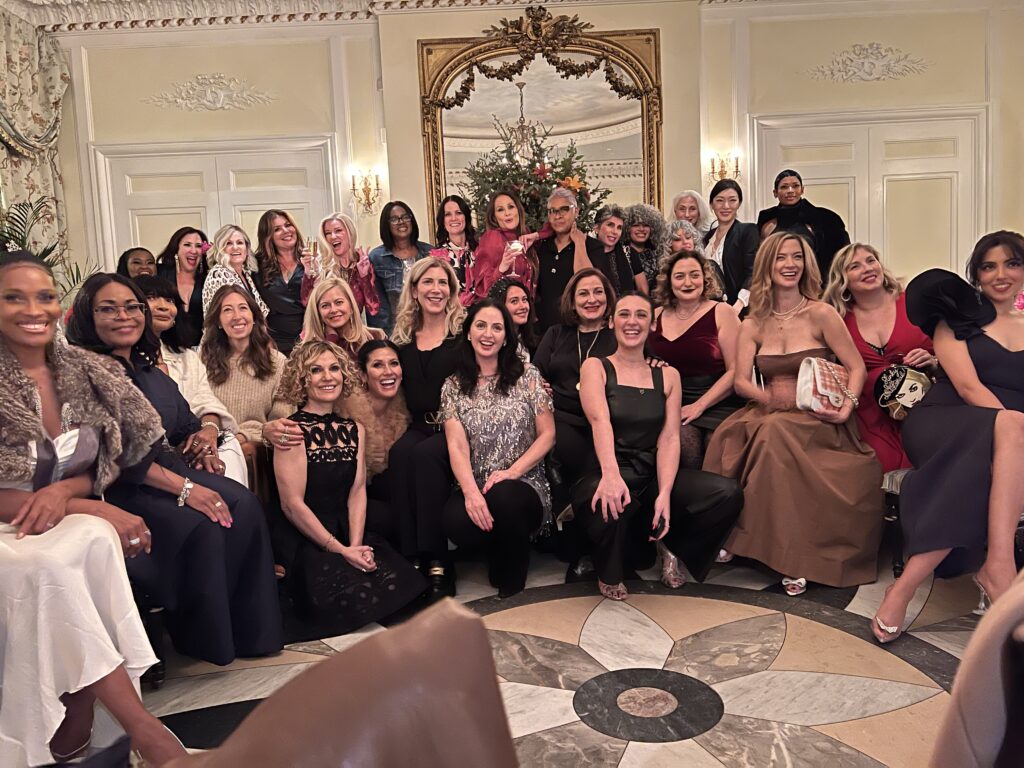 The entire group of mostly over 50 Influencers that attended the Laura Geller Holiday Soiree at Ladurée Soho celebrating 25 years of beauty.