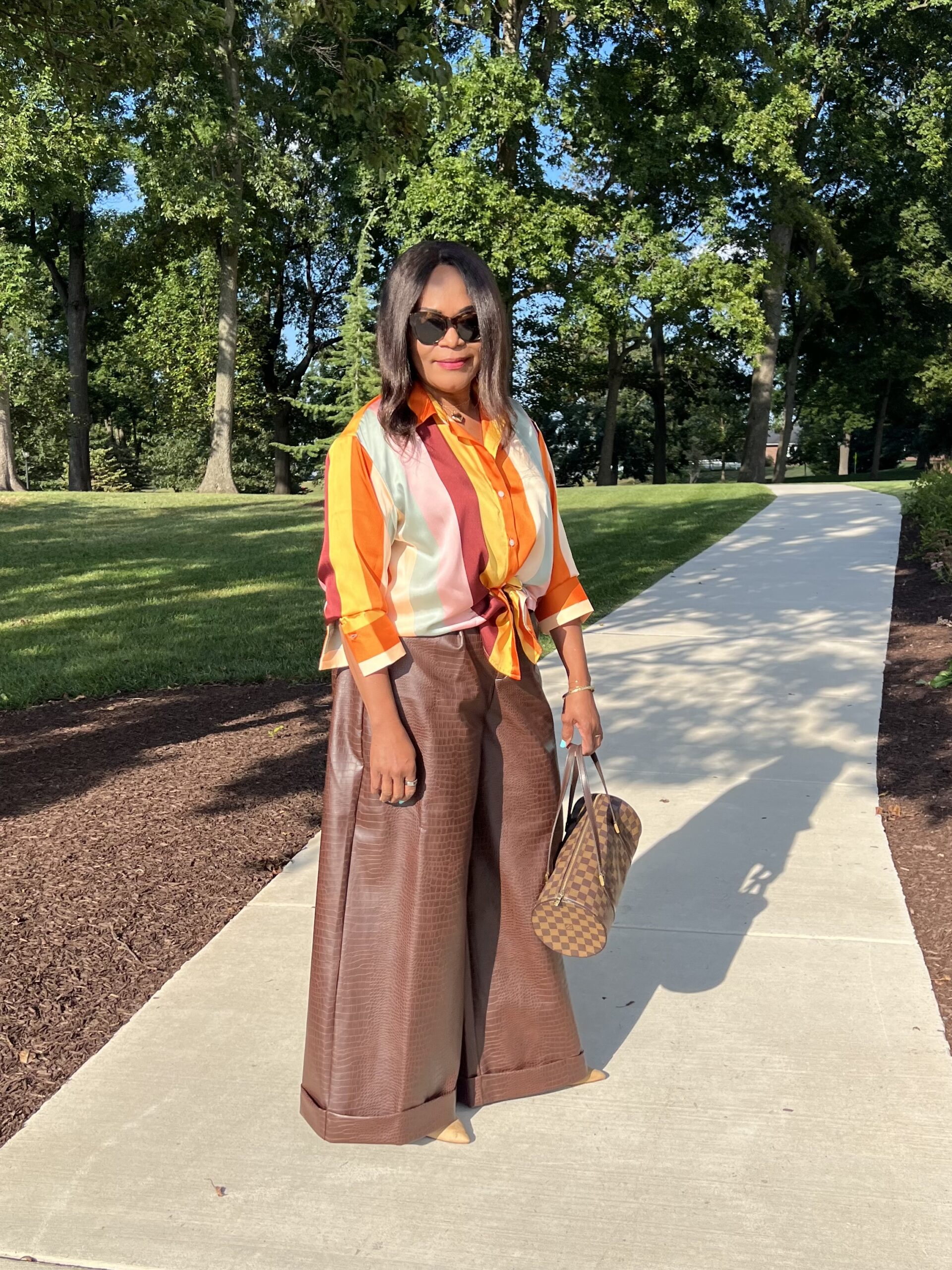 I shopped my closet for Fe Noel x Target Stripe Blouse and Kai Collective Croc Faux Leather Wide-leg Trousers since fall us knocking at our door.