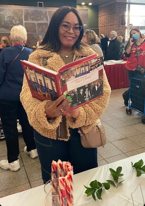 Holding Coleen Christian Burke's Book at the 40th PA Christmas + Gift Show