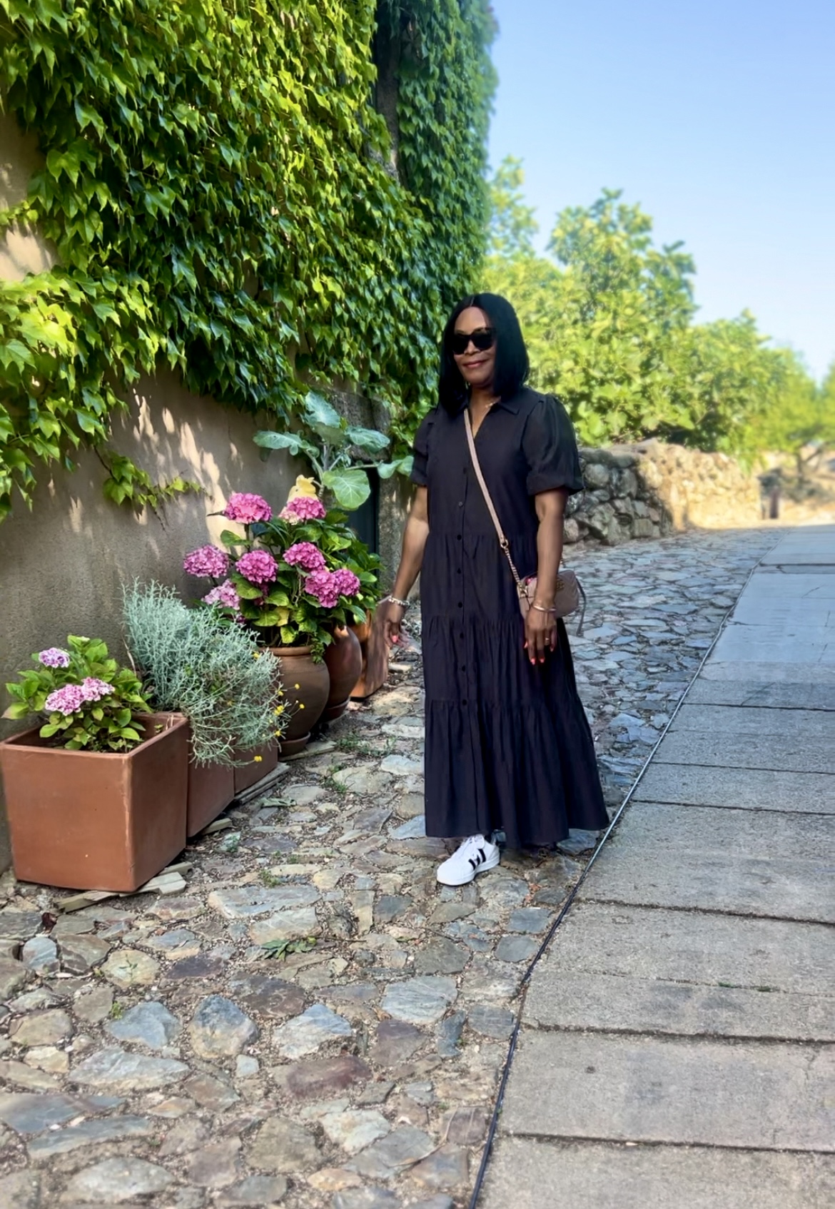 Cabelo Rodrigo, historic village in Center of Portugal. Wearing Brochu walker maxi dress with Addidas. Slow-down travel and hospitality in the Center of Portugal.