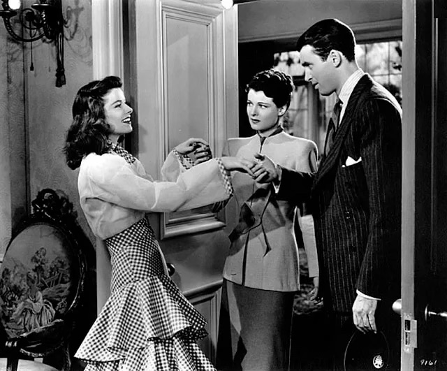 Katherine Hepburn as Tracy Lord in The Philadelphia Story wearing a beautiful eye-pleasing gingham dress designed by Adrian